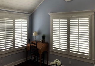 Plantation shutters in an attic window